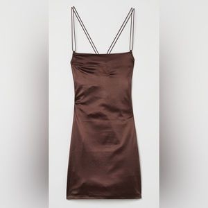 Fitted brown dress. Straps crossed at back. Beautiful stylish dress.